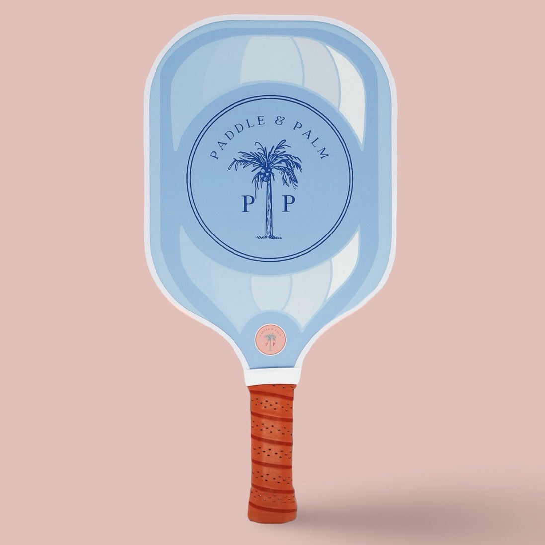 The back of a cute pickleball paddle with a blue design