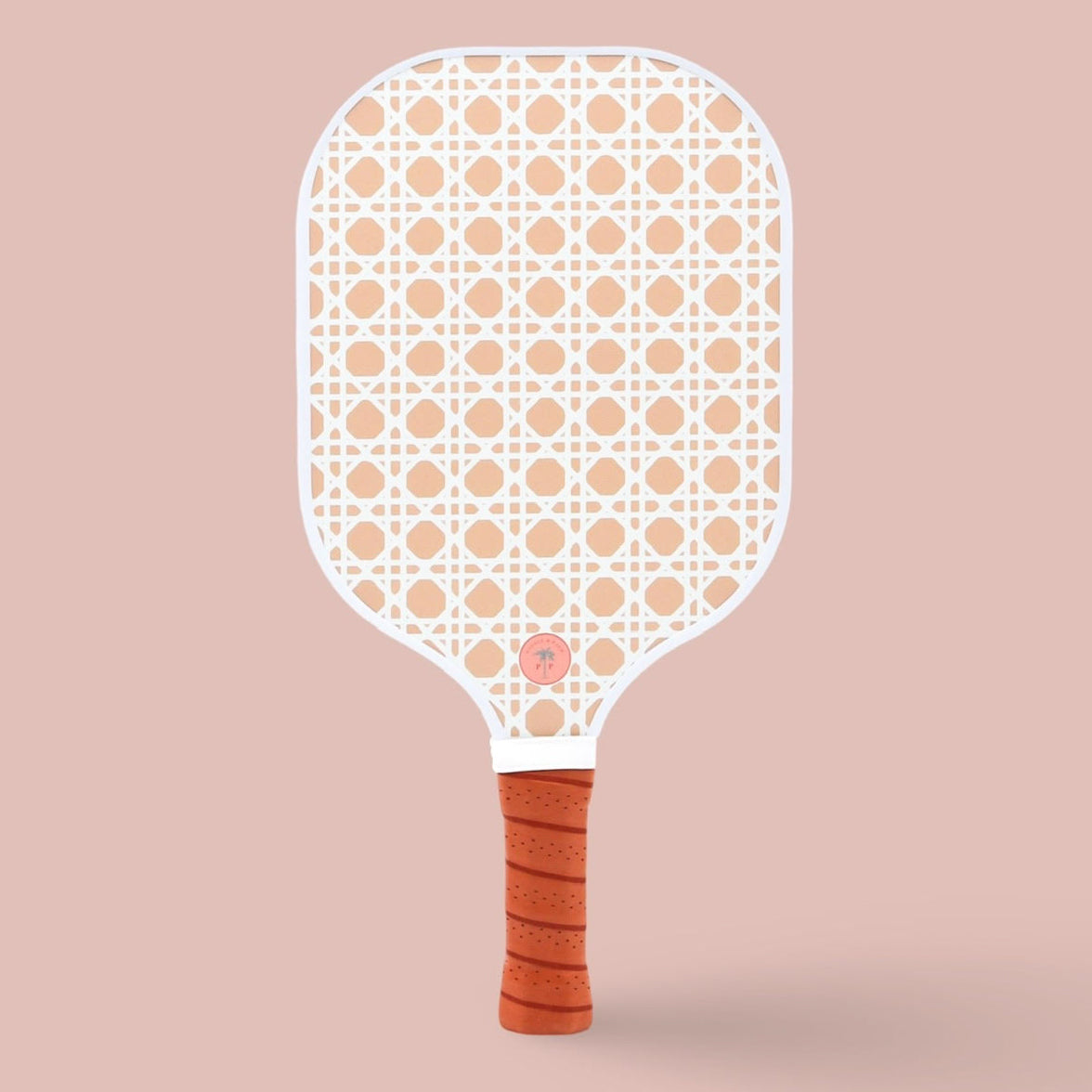 The back of a cute pickleball paddle with a white wicker-style pattern