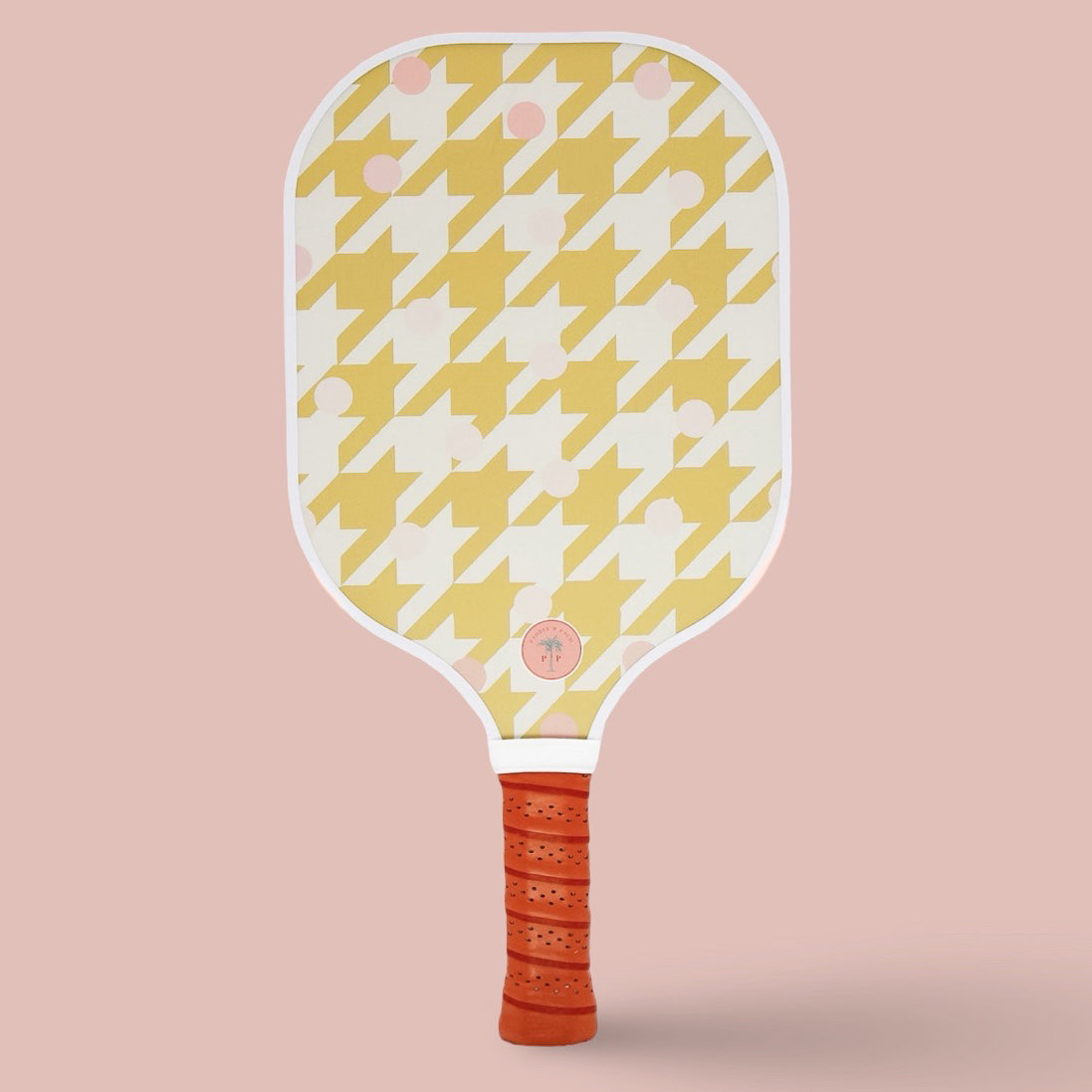 The back of a cute pickleball paddle with a yellow design