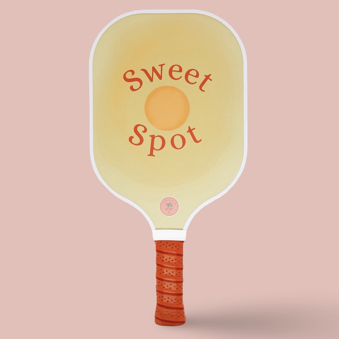 The front of a cute pickleball paddle with a yellow design