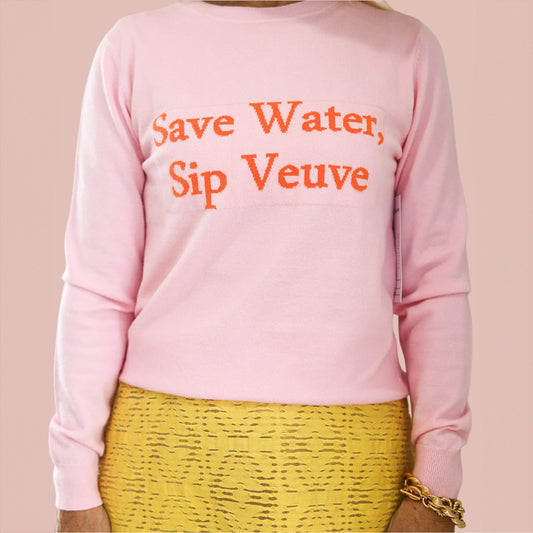 A pink sweater with the words "Save Water, Sip Veuve"
