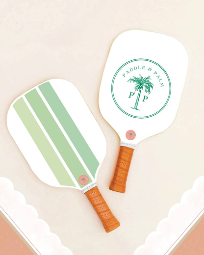 Both sides of a cute pickleball paddle with a green design