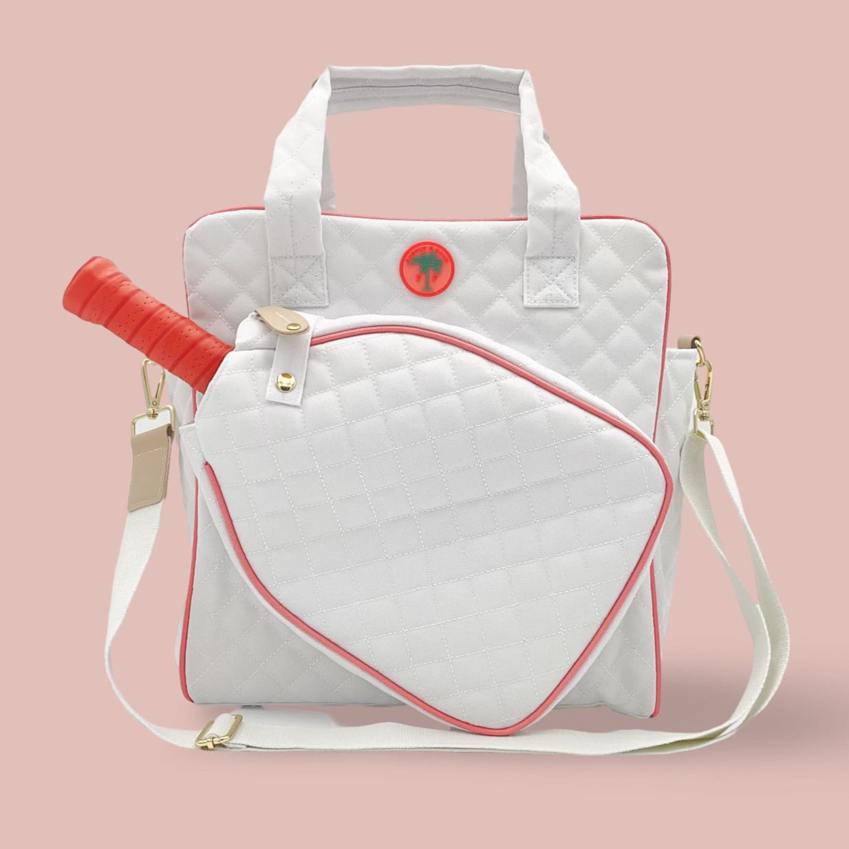 A quilted white and pink pickleball tote bag