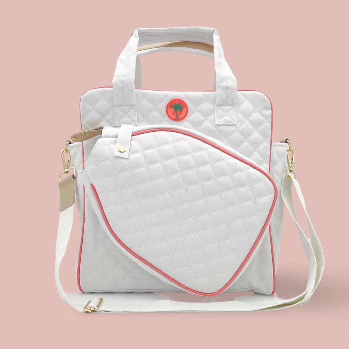 A quilted white and pink pickleball tote bag