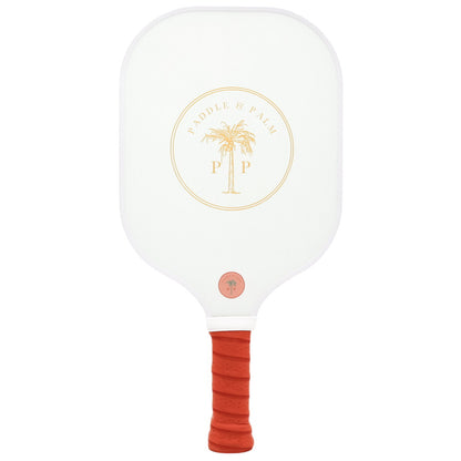 The back of a cute pickleball paddle with a yellow paddle and palm logo