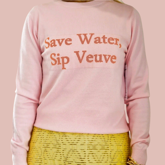 Pink sweatshirt with 'Save Water, Sip Veuve' text on a pink background